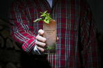 Stonecutter Spirits Twin Peaks themed cocktail with hands and flannel shirt. By commercial photographers at JAM Creative.