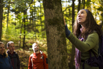 A guide from Country Walkers guided tours explains the local fauna during their tour of Waterbury, Vermont. By JAM Creative.
