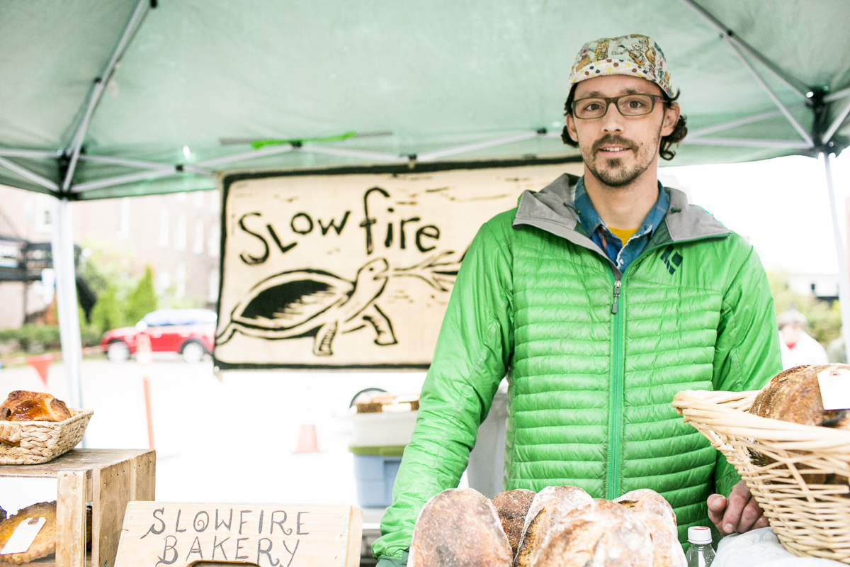 Scott Medellin of Slowfire Bakery poses for a portrait at his booth in the Burlington Farmers Market in City Hall Park on Saturday, October 6, 2018. by JAM Creative for Yankee Magazine