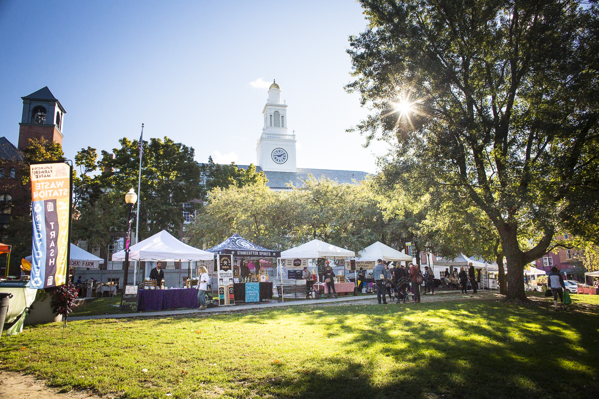 Marketgoers wander between booths at the summer Burlington Farmers Market in City Hall Park on Saturday, September 29, 2018. by JAM Creative for Yankee Magazine