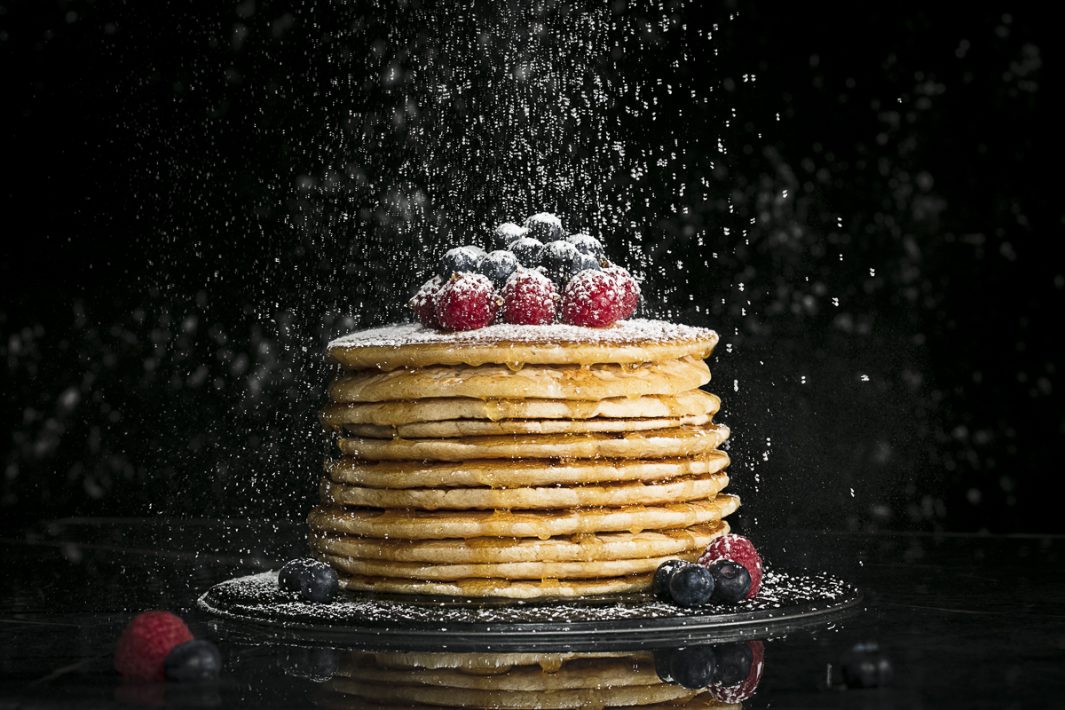 Food Photography of pancakes, maple syrup and berries for runamok maple. by Burlington Vermont Commercial Photographers JAM Creative.