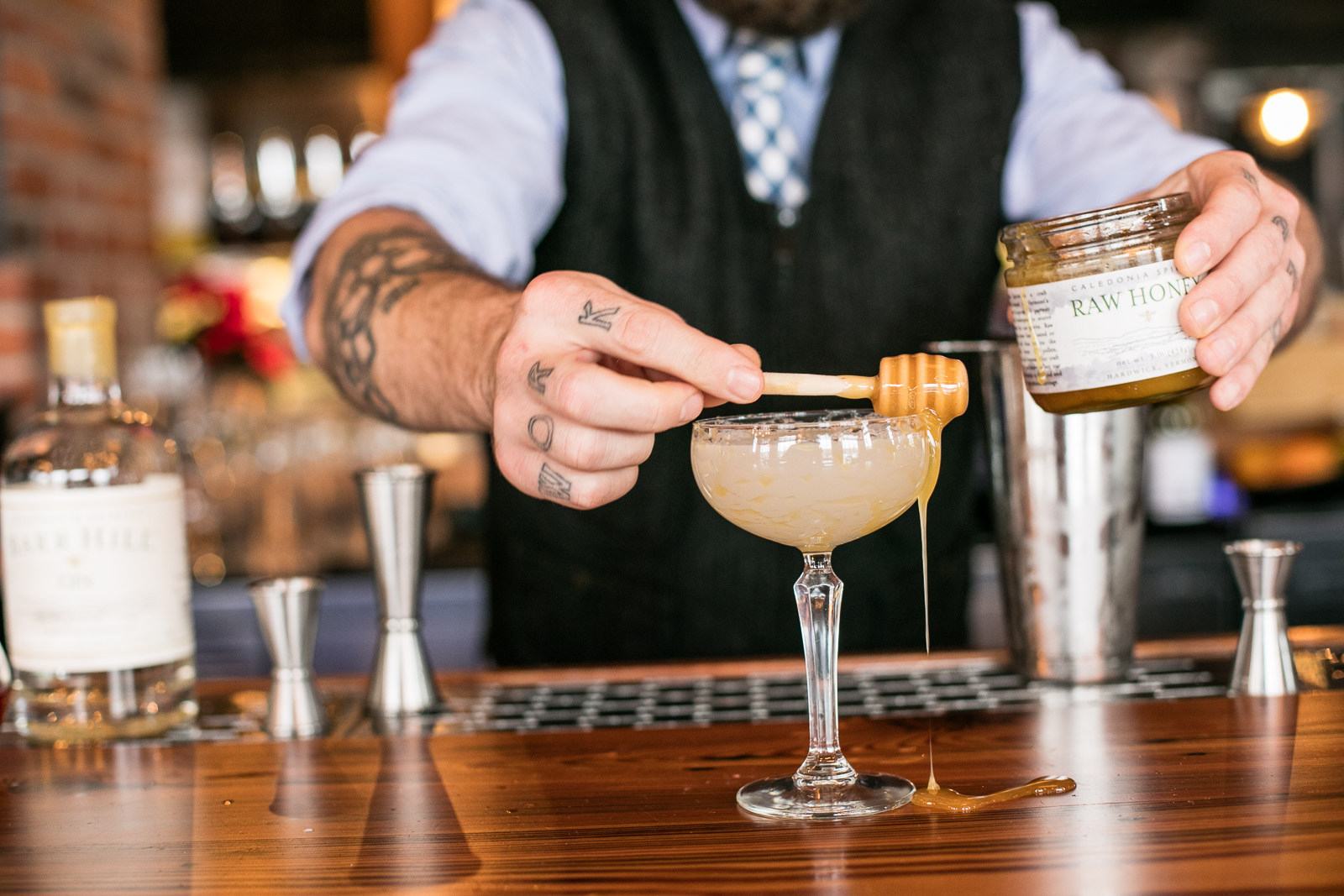 A bartender makes Caledonia Spirits cocktails at Waterworks in Winooski, Vermont. by Reciprocity Studio for Caledonia Spirits.