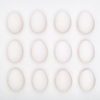 A dozen eggs on white shot in studio by Vermont photographers Reciprocity Studio in Burlington.