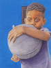 An Afro-Cuban boy holds a basketball against blue wall. 