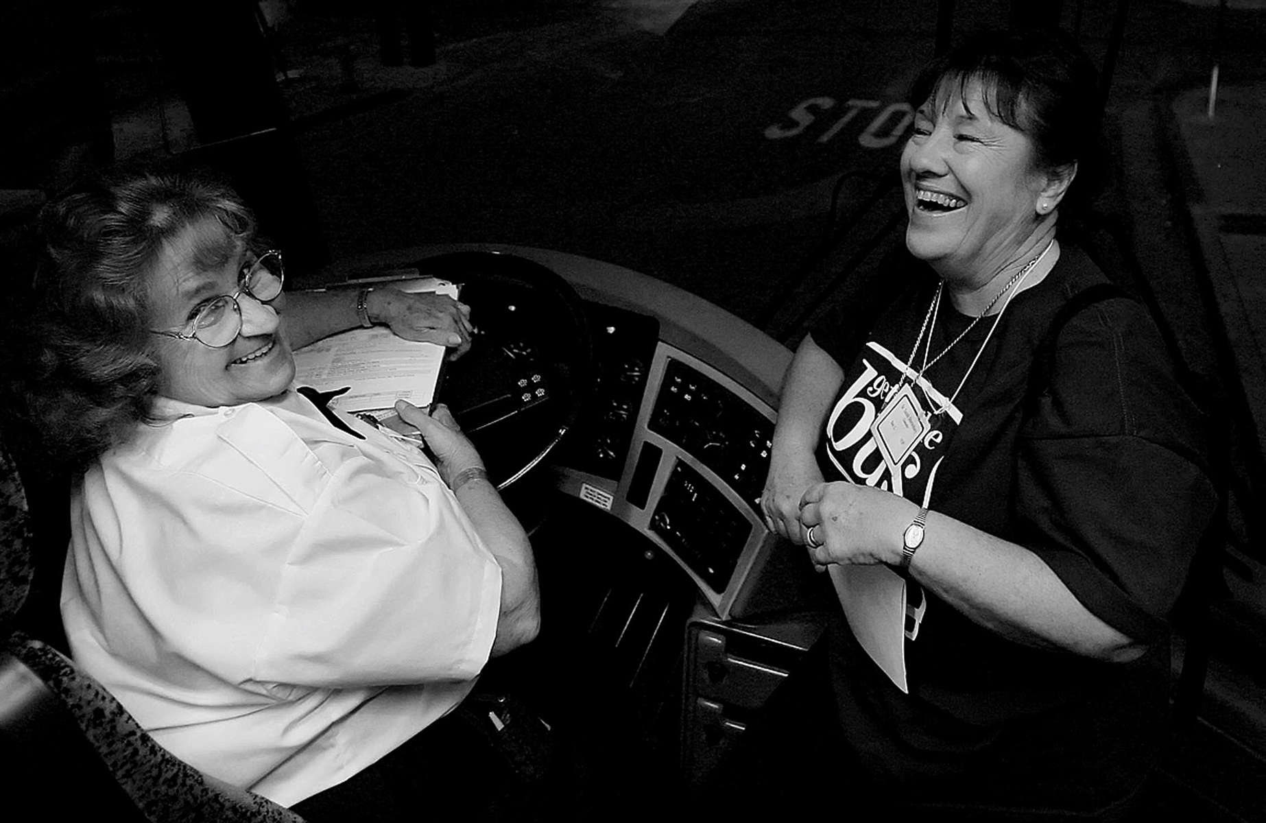 Coach America bus driver Viola Connor, left, and Sister Sara Shrewsbury, Diocese of San Bernardino vocational director and coordinator for Get on the Bus, joke around while planning the route from St. James Catholic Churchin Perris, Calif., to the Valley State Prison For Women in Chowchilla, Calif. (The Press-Enterprise/ Mark Zaleski)
