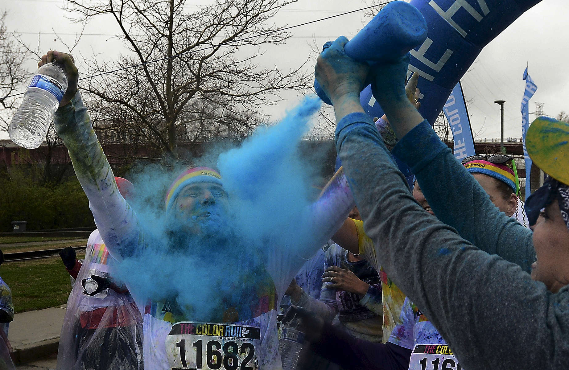 A runner gets squirted with blue powderin the 5K Color Run in Nashville, Tenn. (Mark Zaleski/ For The Tennessean)