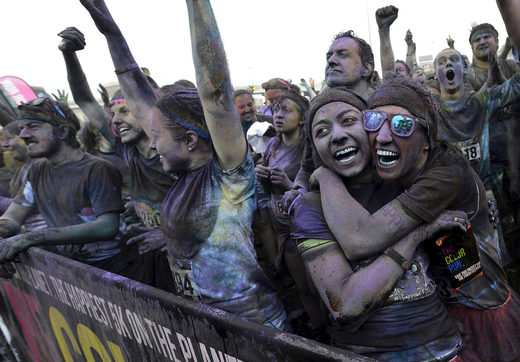 Runners listen to music in the festival areaafter the 5K Color Run in Nashville, Tenn.(Mark Zaleski/ For The Tennessean)
