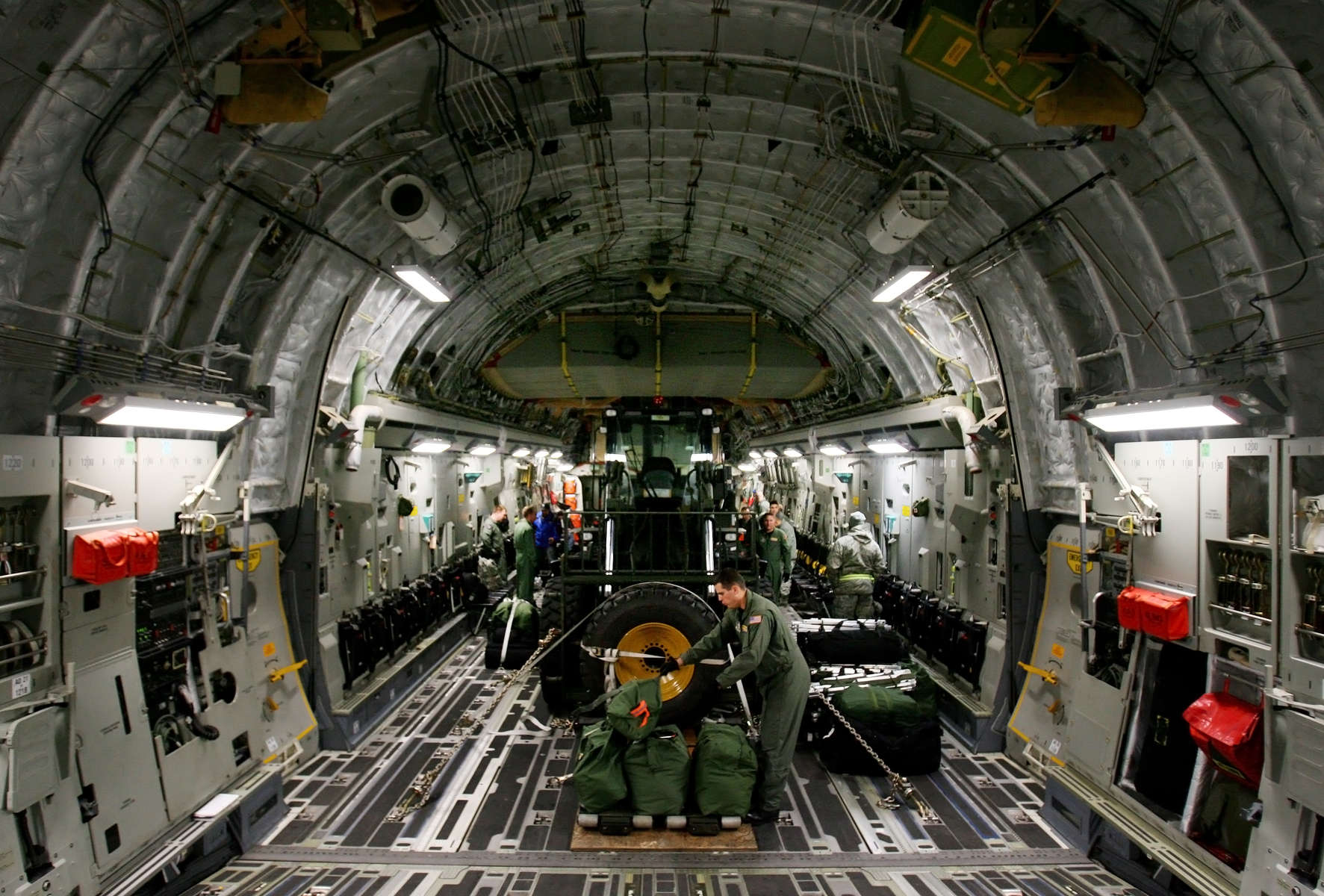 March Air Reserve Base C-17 aircrew Master Sgt. James ties down suppies in the cargo bay of the C-17 at McChord Air Force Base in Wash. (The Press-Enterprise/ Mark Zaleski)