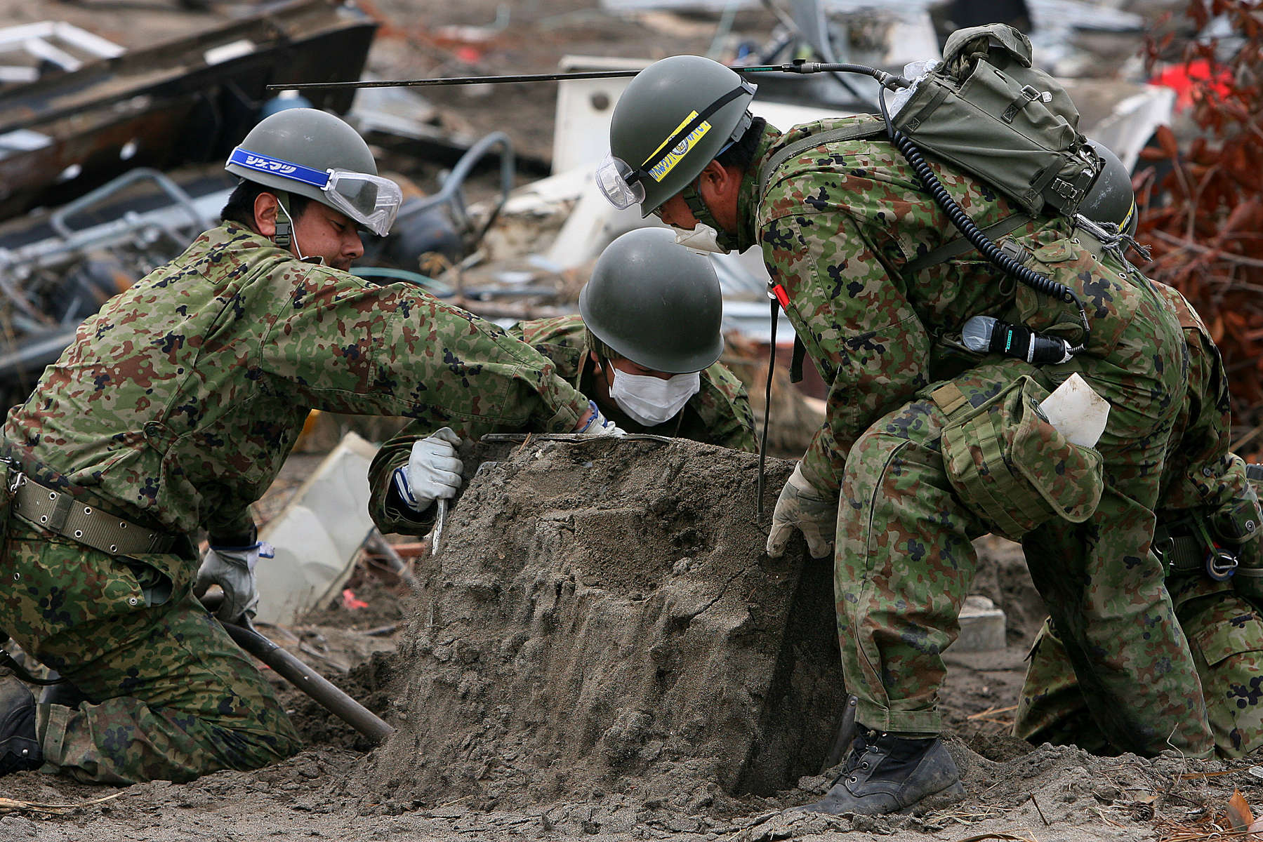 Thousands of people were unaccounted for a month after the tsunami hit Sendai, Japan. A team looks for the remains of those missing.(The Press-Enterprise/ Mark Zaleski)