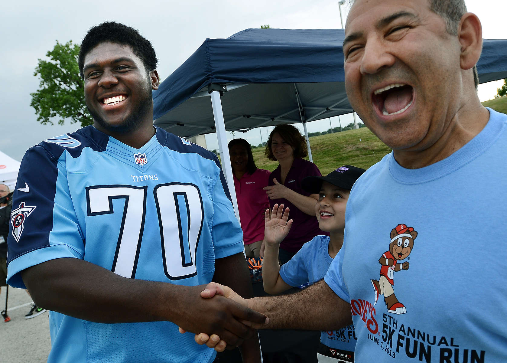 Tennessee Titians first-round draft pick Chance Warmack and David Davoudpour share a laugh together at the Shoney's 5K family fun run and walk benefiting the Nashville Police Support fund on June 1, 2013 in Nashville, Tenn.(The Tennessean/ Mark Zaleski)