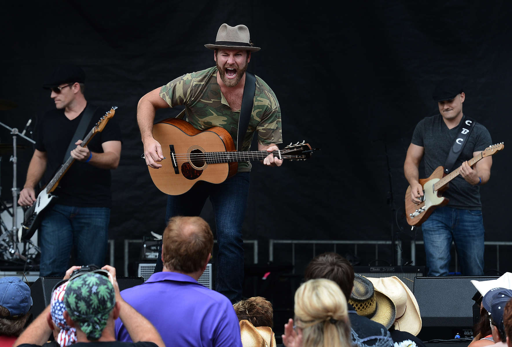 Drake White performs for the crowd at the Bud Light Stage at Bridgestone Arena during the 2013 Country Music Festival in Nashville, Tenn. (The Tennessean/ Mark Zaleski)