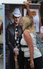 After having her photograph taken by her husband, Carol Brinkley, of North Carolina, kisses a full size poster of country music singer Brad Paisley alongBroadway during the 2013 Country Music Festival in Nashville, Tenn. (The Tennessean/ Mark Zaleski)