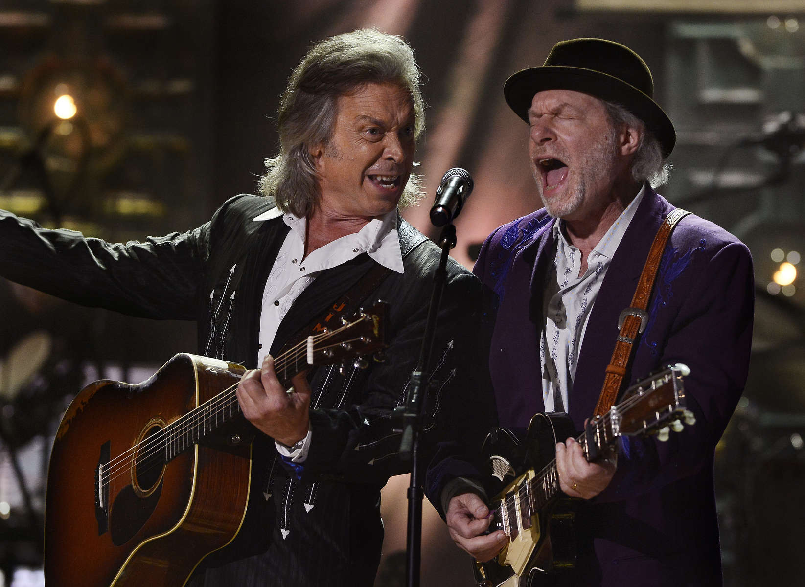 Jim Lauderdale, left, and Buddy Miller perform during the 2014 Americana Music Honors and Awards in Nashville, Tenn. (AP Photo/ Mark Zaleski)