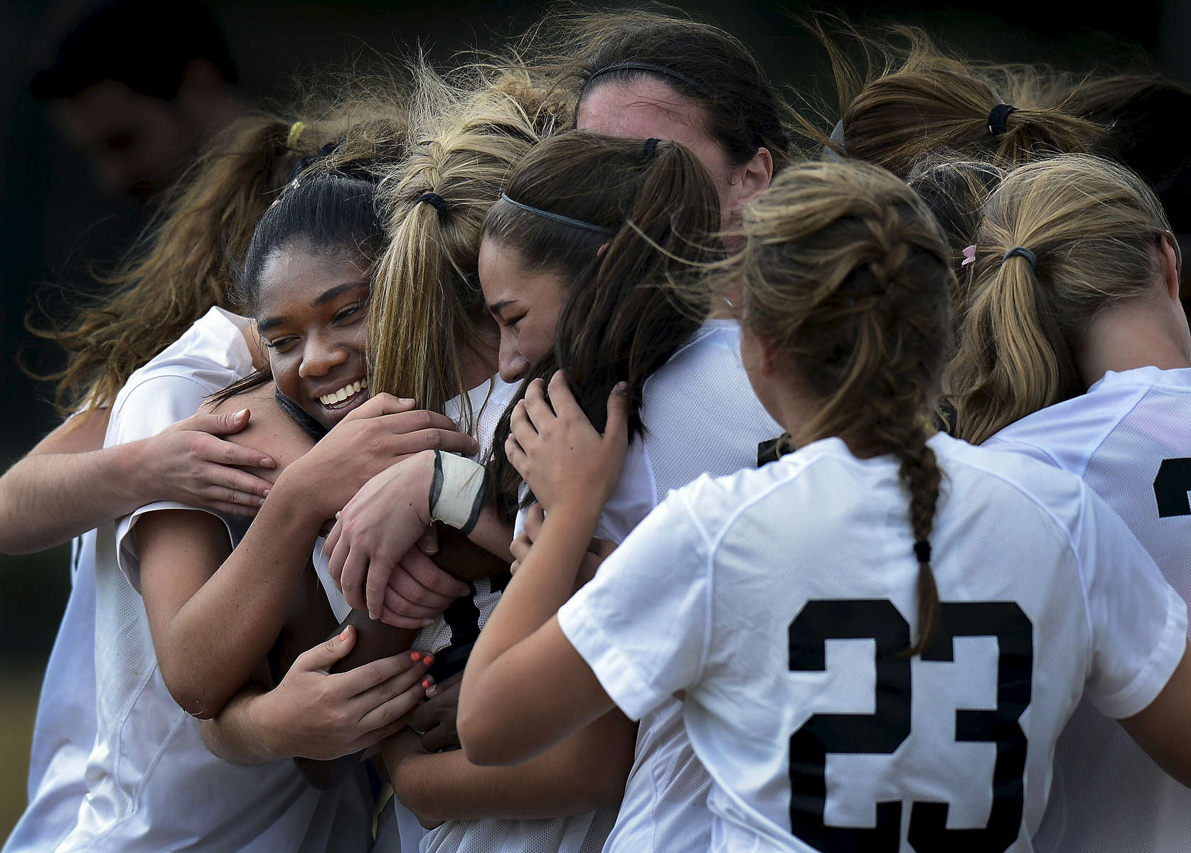 Houston Lady Mustang Gabby Little is mobbed by her teammates as they celebrate a 3-1 winover Ravenwood High School in the Class AAA State girls soccer championshipin Murfreesboro, Tenn. (Mark Zaleski/ The Tennessean)