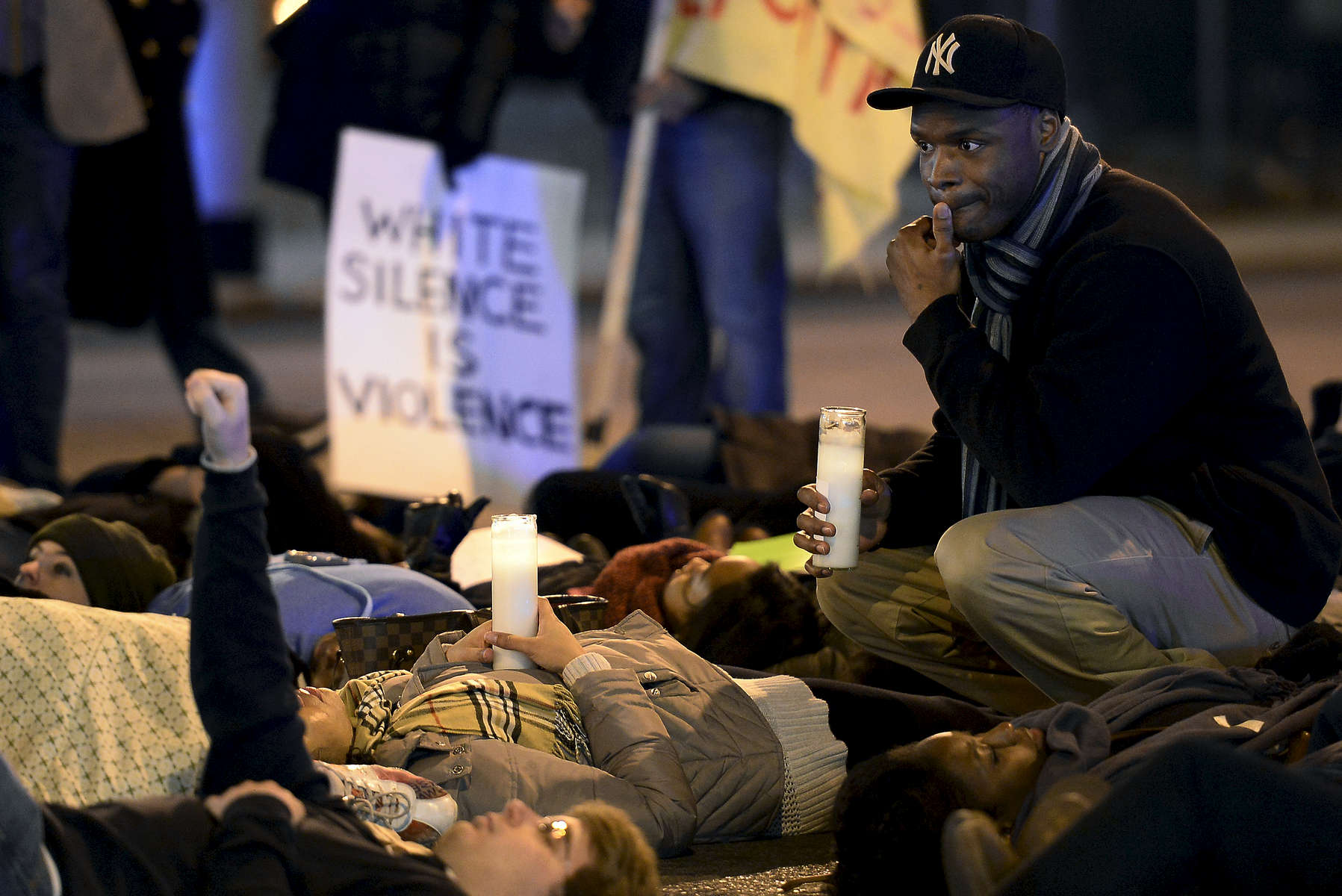 Demonstrators stage a die-in at the corner of 12thAvenue South and Broadway during a march in Nashville, Tenn. They were protesting against a New York grand jury's decision not to indict the Staten Island police officers involved in the deathof Eric Garner. (The Tennessean/ Mark Zaleski) 