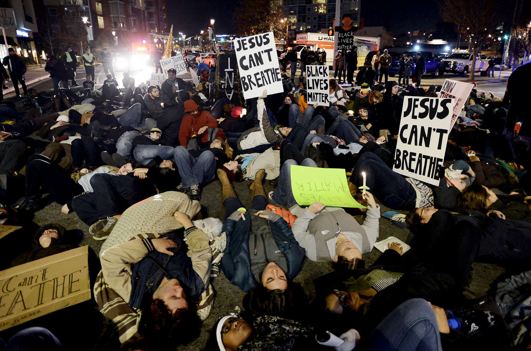 Demonstrators stage a die-in at the corner of Pine Street and 11 Avenue South during a march inNashville, Tenn. They were protesting against aNew York grand jury's decision not to indict the Staten Island police officers involved in the death of Eric Garner. (The Tennessean/ Mark Zaleski) 