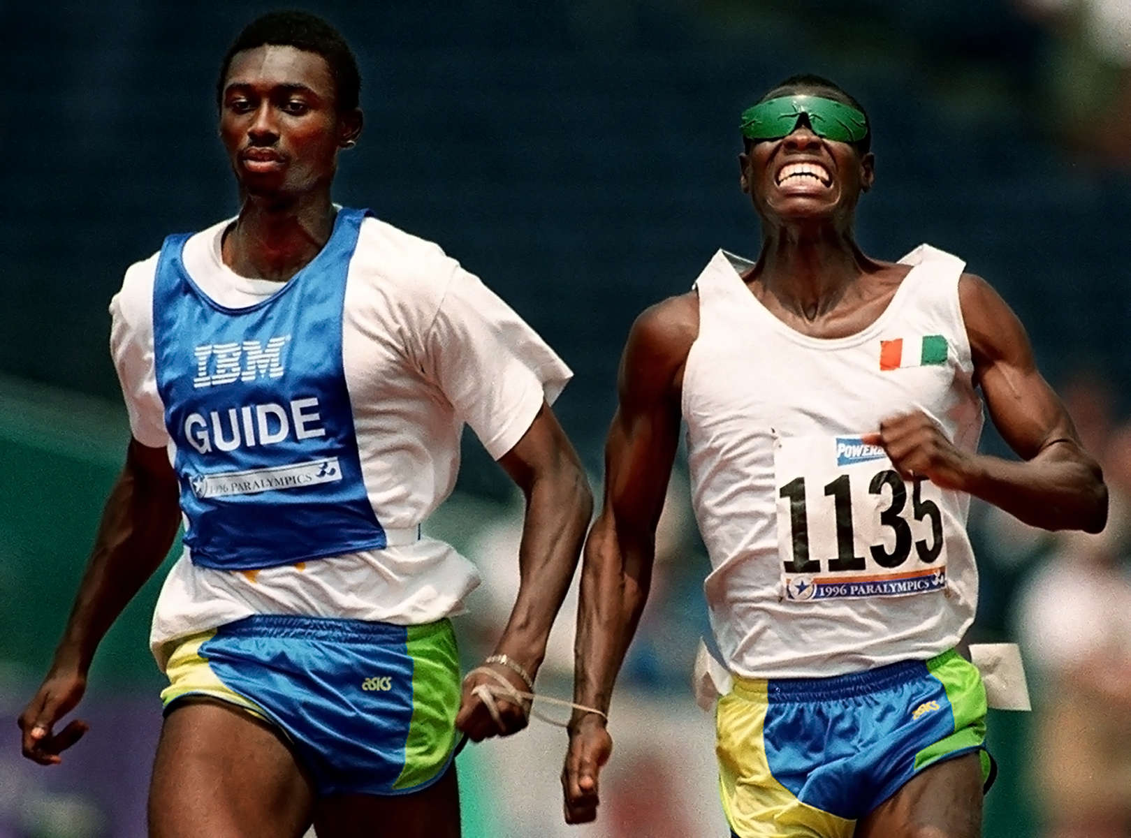 Gaston Tra Bi Yaly, of Côte d'Ivoire, competes in the 100m event for the blind with the help of a running guide. Yaly is joined to his guide using a rope attached around their hands.(The San Bernardino Sun/ Mark Zaleski) 