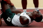 Adeoye Ajibola of Nigeria reacts after pullinghis hamstring muscle in the 100 meter amputee classification race. Ajibola won the gold and a new Paralympic world record in the 100 meter event with the time of 11.13 seconds. (The San Bernardino Sun / Mark Zaleski)