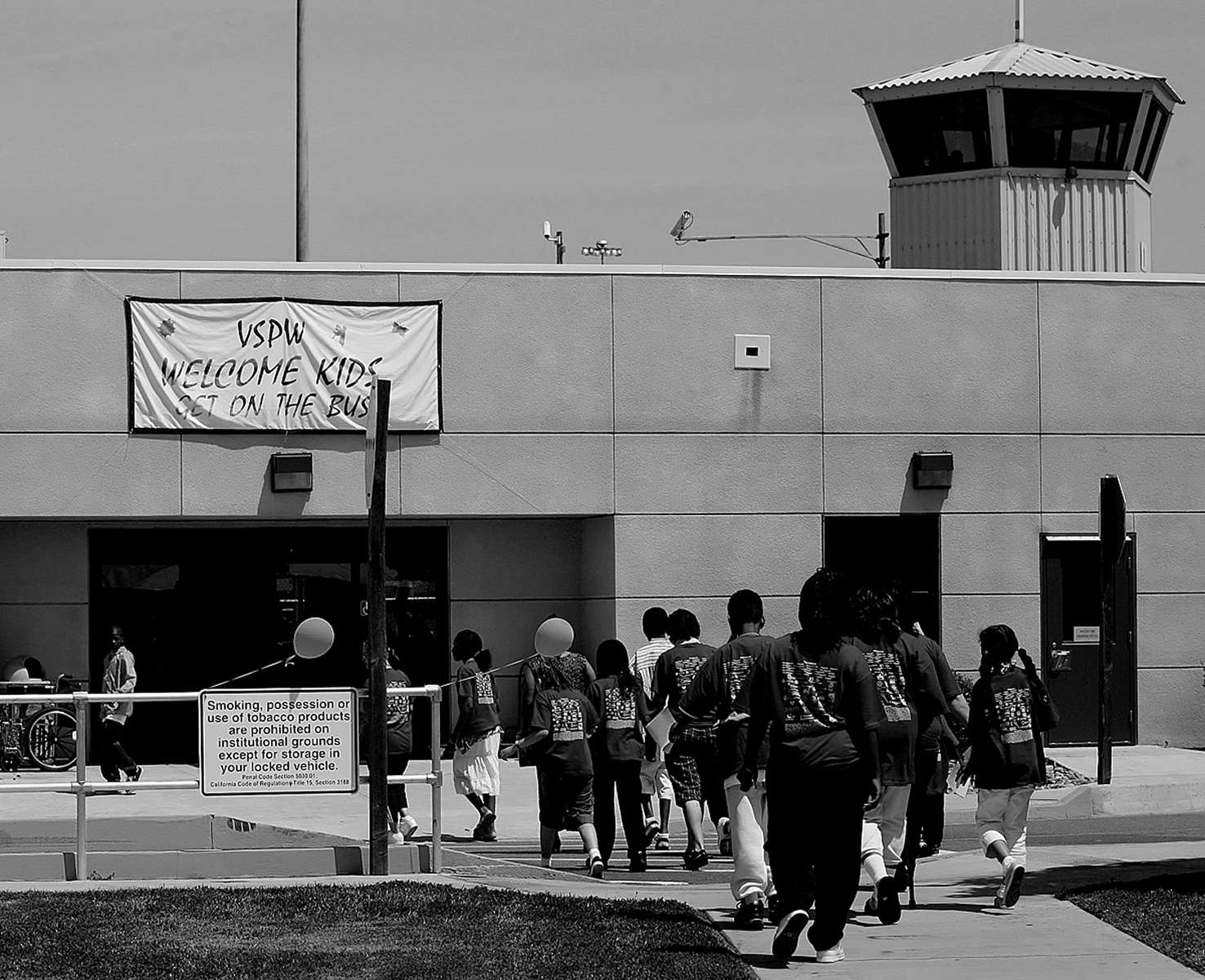 Participants in the Get on the Bus program enter the prison, and go through security processing before seeing inmates. (The Press-Enterprise/ Mark Zaleski)