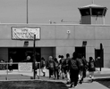 Participants in the Get on the Bus program enter the prison, and go through security processing before seeing inmates. (The Press-Enterprise/ Mark Zaleski)