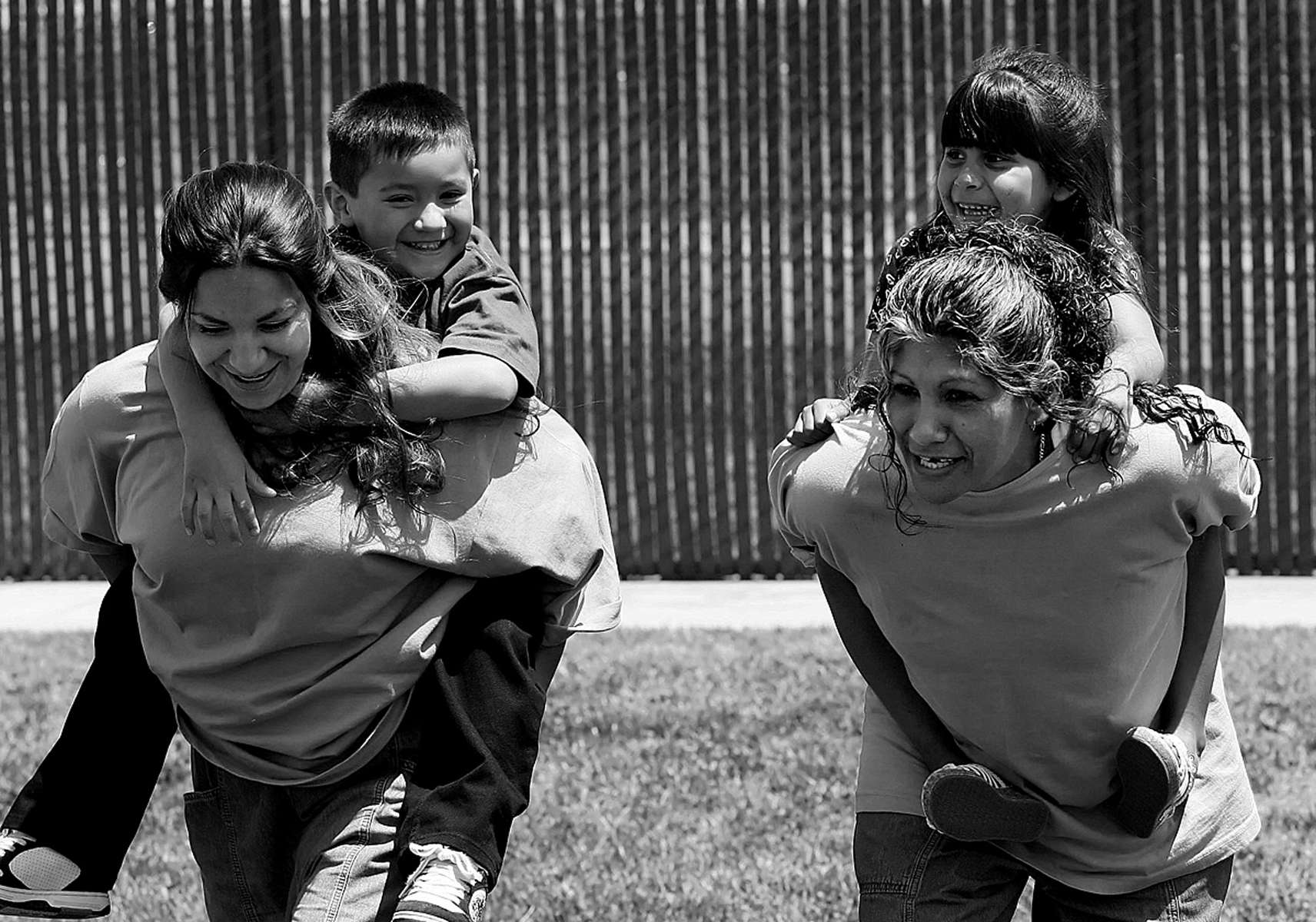 Marisol Gutierrez and her son, Jonathan Vargas, 6, of Los Angeles, Calif., left, play around with Antonia Salazar and her daughter, JessicaTorres of Bakersfield, Calif., during the visit to the prison. The children and their mothers had three hours to together. (The Press-Enterprise/ Mark Zaleski)