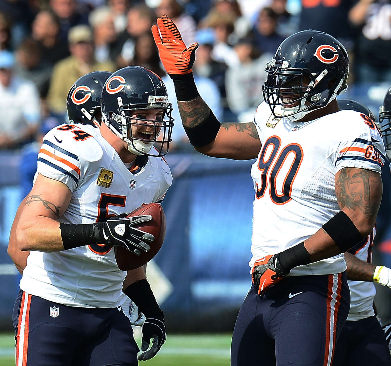 Chicago Bears middle linebacker Brian Urlacher celebrates with teammate defensive end Julius Peppers after Urlacher recovered a fumble by Tennessee Titans wide receiver Kenny Britt in the first half on Nov. 4, 2012 in Nashville, Tenn. (The Tennessean/ Mark Zaleski)