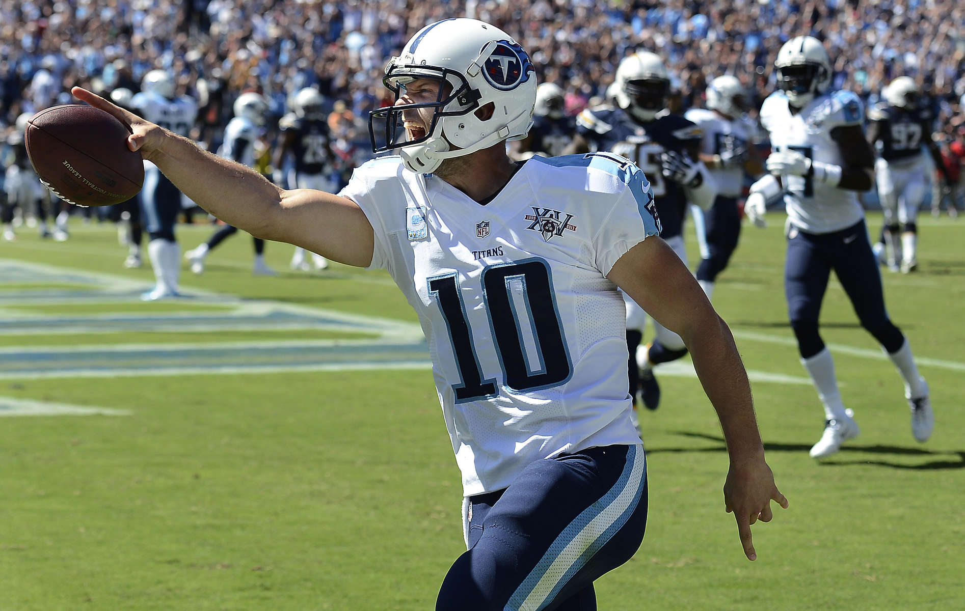 Tennessee Titans quarterback Jake Locker celebrates as he scores a touchdown on a 7-yard run against the San Diego Chargers in the second quarter of an NFL football game on Sept. 22, 2013, in Nashville, Tenn. (AP Photo/ Mark Zaleski)