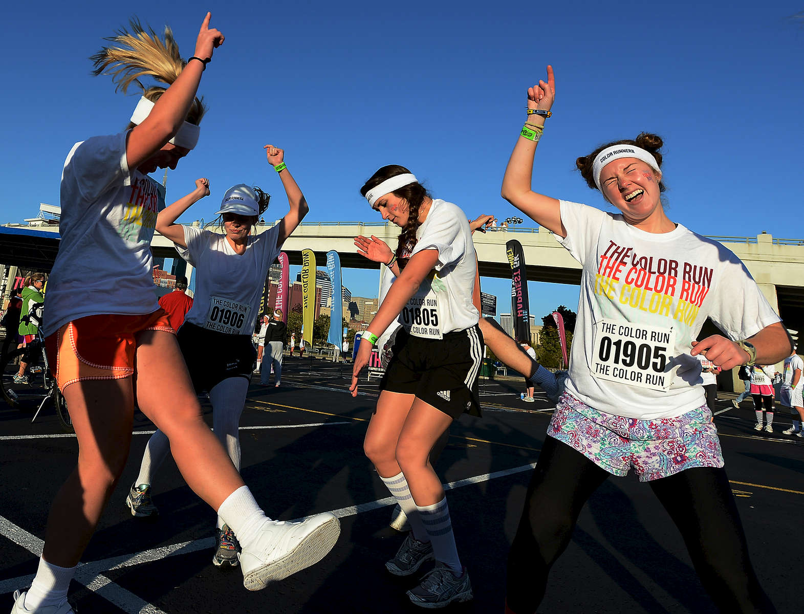 A group of participants dance around listening to music while getting pumped up to compete in the 5K Color Run in Nashville, Tenn. (Mark Zaleski/ For The Tennessean)