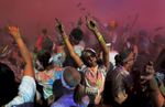 After an eruption of colored powder packets, runnersare covered with the fine dust and dance to music atthe end of the 5K Color Run in Nashville, Tenn. (Mark Zaleski/ For The Tennessean)
