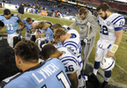 Indianapolis Colts quarterback Andrew Luck stands with injured Tennessee Titans quarterback Jake Locker as players pray after an NFL football game on Nov. 14, 2013, in Nashville, Tenn. The Colts won 30-27. (AP Photo/ Mark Zaleski)