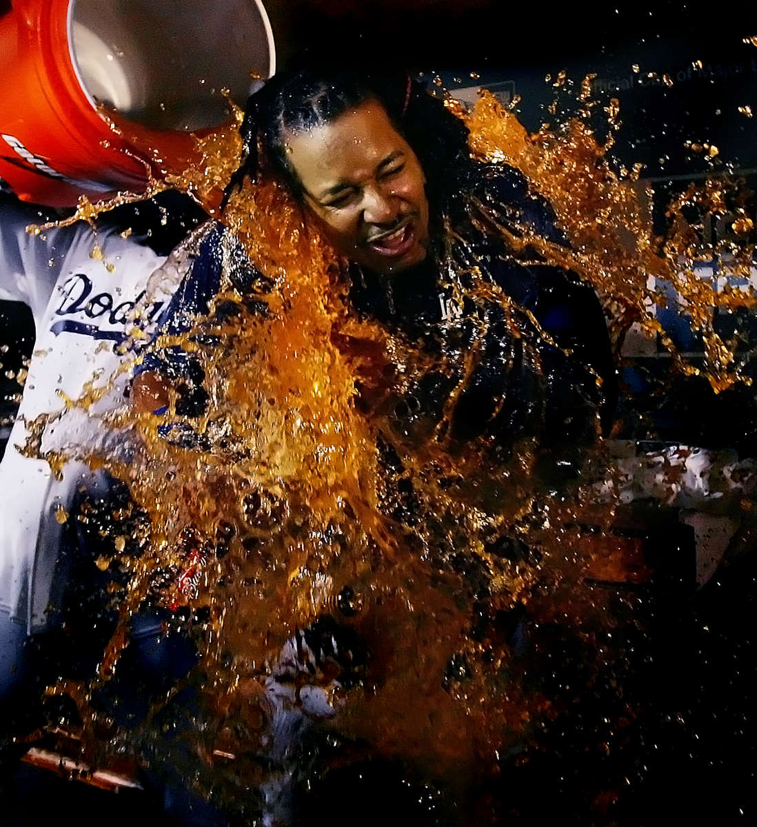 Los Angeles Dodgers outfileder Manny Ramirez gets doused by teammate Takashi Saito after the Dodgers beat the Chicago Cubs 3-1 to win the National League Division Series at Dodgers Stadium in Los Angeles Calif. (The Press-Enterprise/ Mark Zaleski)