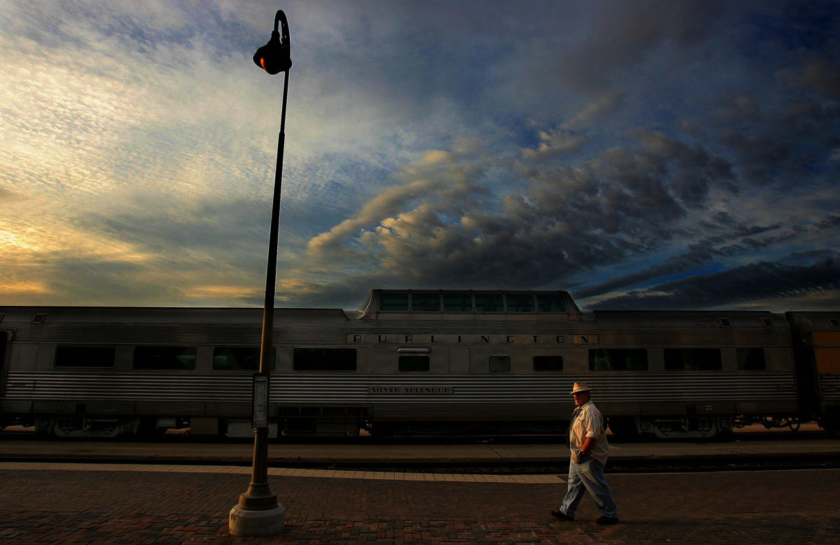 A passenger walks past the Silver Splendor car with a dome dining lounge while waiting to board the KelsoFlyer at the Barstow Depot in Calif. The Kelso Flyer is a passenger train with six vintage cars pulled by an Amtrack engine. The day excursion started at theBarstow Depot, crossed the scenic Mojave National Preserve and ended at the mission-style Kelso Depot. (The Press-Enterprise/ Mark Zaleski)