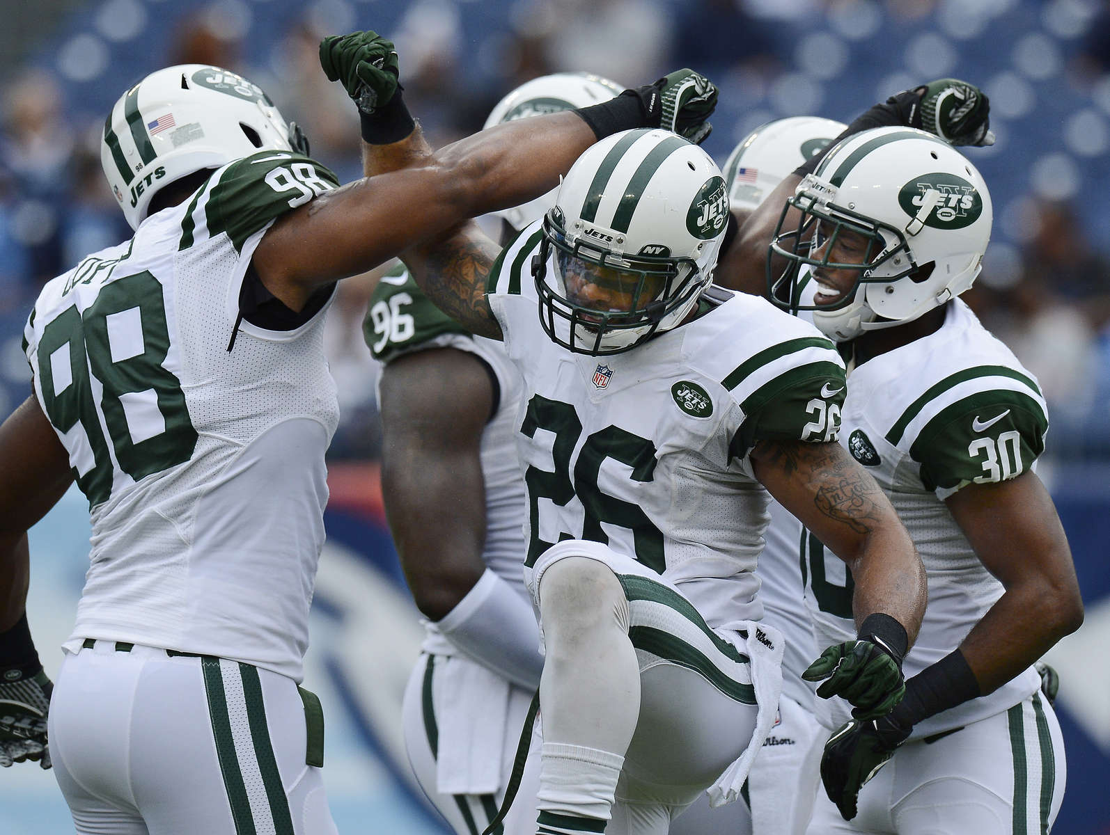 New York Jets players Quinton Coples, Dawan Landry and Darrin Walls get ready for an NFL football gameagainst the Tennessee Titans on Sept. 29, 2013, in Nashville, Tenn. (AP Photo/ Mark Zaleski)
