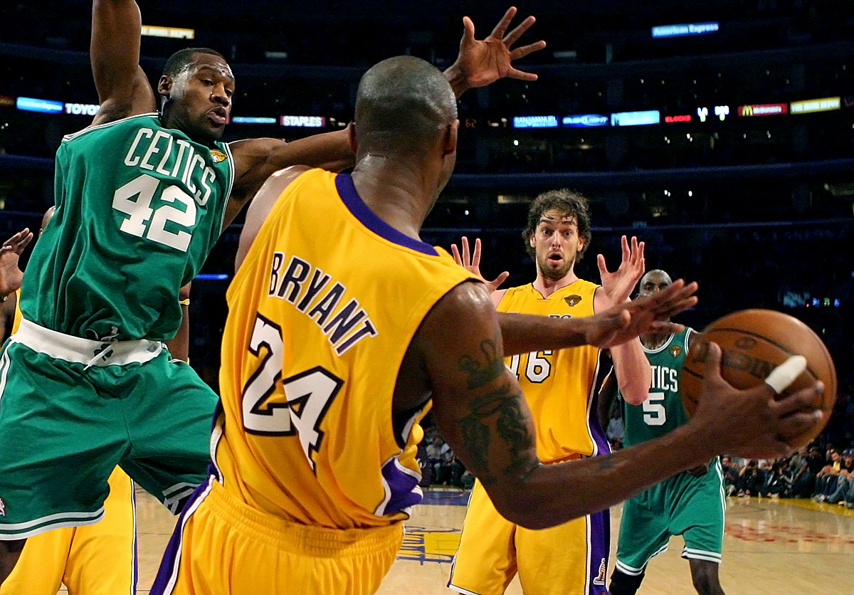 The Los Angeles Lakers guard Kobe Bryant passes the ball to teammate Paul Gasol while being defended by Boston Celtics forward Tony Allen during Game 1 of the NBA Finals at the Staples Center in Los Angeles, Calif. (The Press-Enterprise/ Mark Zaleski)