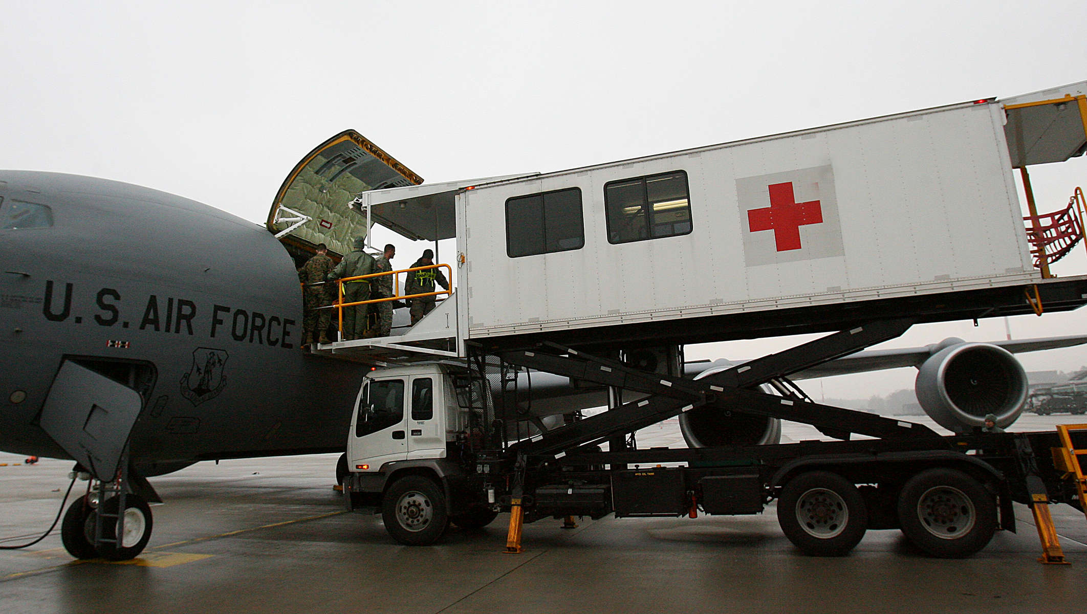 A Ramstein Air Force Base air evacuationmedical team unload wounded warriors from a KC-135 using a high deck patient loading platform. (The Press-Enterprise/ Mark Zaleski)