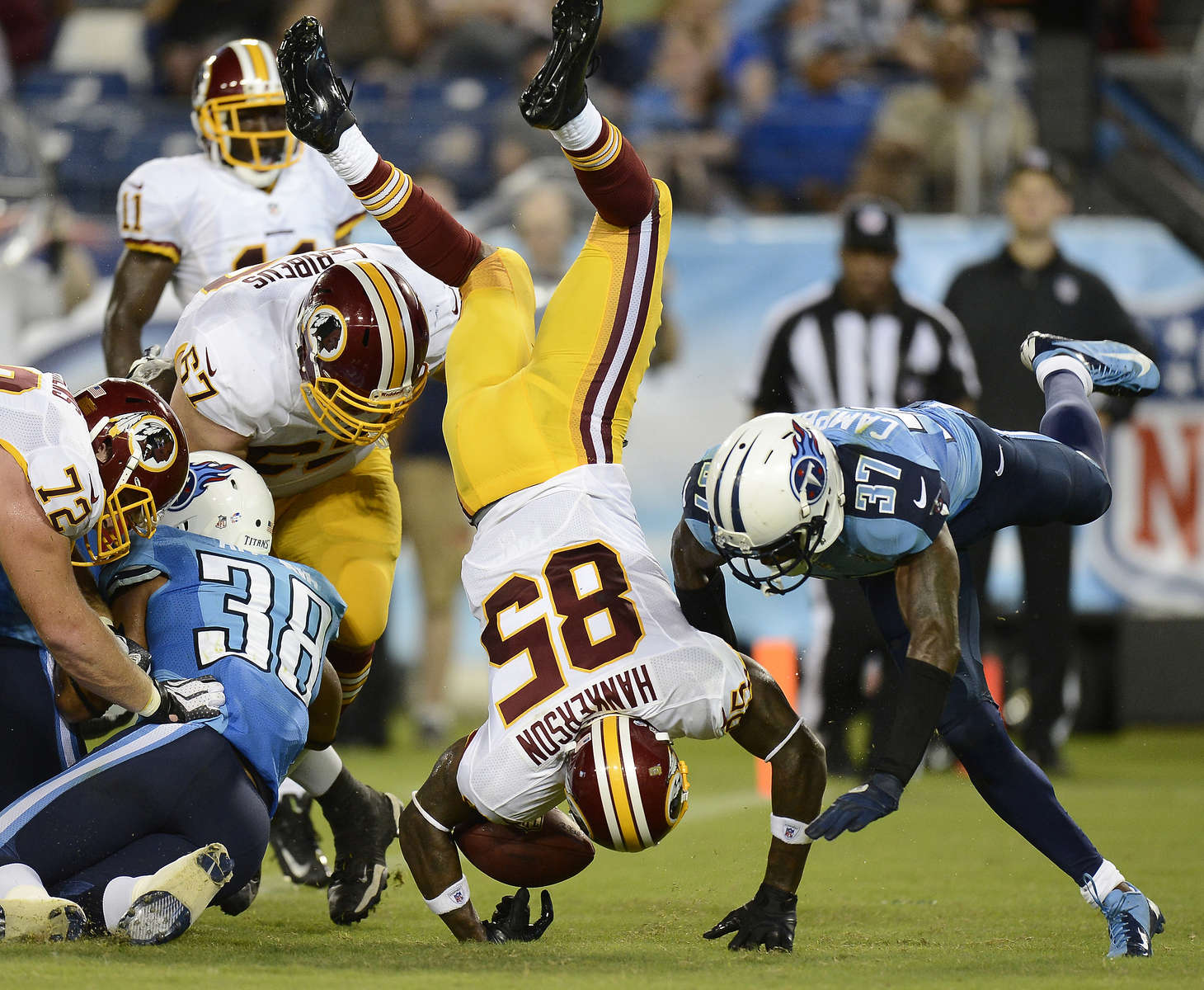 Washington Redskins wide receiver Leonard Hankerson flips into the end zone as he scores a touchdown on an 8-yard pass play against the Tennessee Titans in the second quarter of a preseason NFL football game on Aug. 8, 2013, in Nashville, Tenn. (AP Photo/ Mark Zaleski)