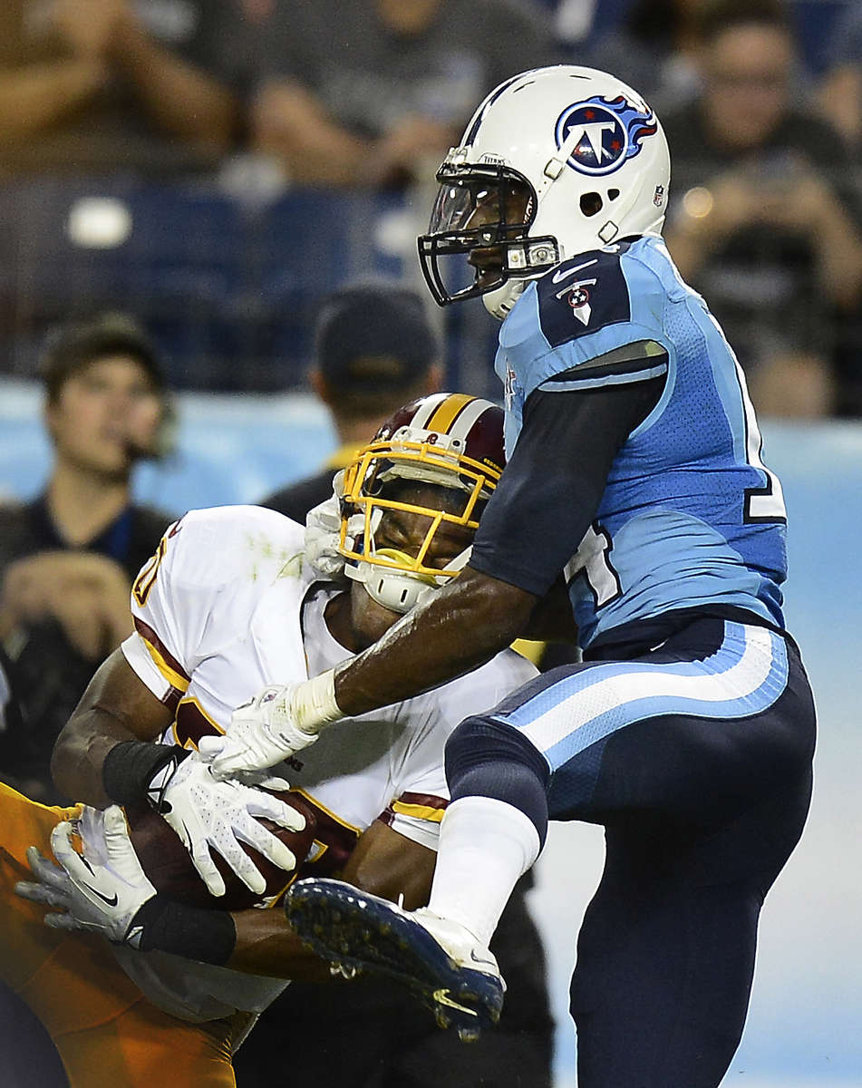 Washington Redskins Richard Crawford intercepts a pass intended for Tennessee Titans Michael Preston in the third quarter in a preseason NFL football game against the Tennessee Titans on Aug. 8, 2013, in Nashville, Tenn. (AP Photo/ Mark Zaleski)