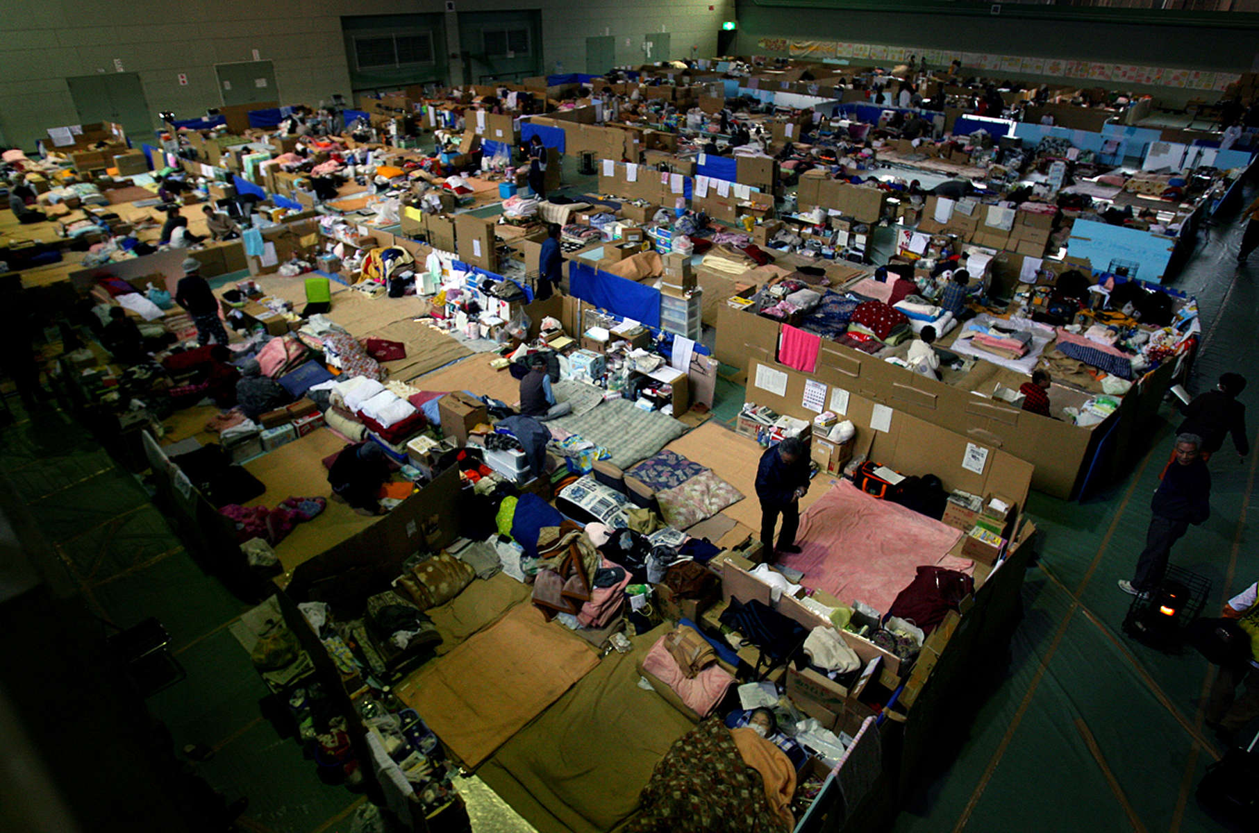320 evacuees have been living in makeshift cardboard partitions at the gym since their homes were destroyed when a 9.0 earthquake and tsunami devastated Sendai, Japan. (The Press-Enterprise/ Mark Zaleski)