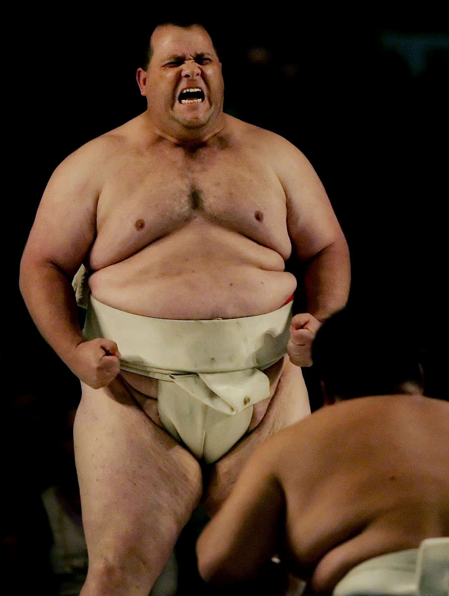 Sumo wrestlers or rikishi, Kelly Gneiting, 405 pounds, left, pumps himself up before going against Koichi Kato of Japan in a heavyweight bout in Los Angeles, Calif., Gneiting lost the match to Kato. (The Press-Enterprise/ Mark Zaleski)