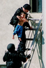 San Bernardino SWAT officers rescue a boy during a hostage standoff in San Bernardino,Calif. (The San Bernardino Sun/ Mark Zaleski)