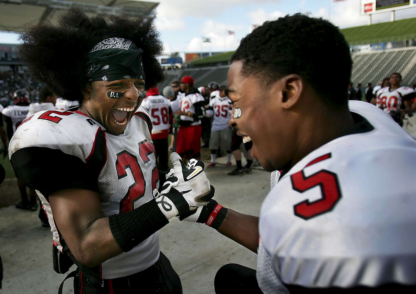 Corona, Calif., Centennial's Jerry Hardeman, left, and Marsel Posey celebrate on the bench before the end of the game. Corona Centennial beat Corona Santiago 42-7 to win the CIF Southern Section Inland Division Championship at the Home Depot Center in Carson Calif. (The Press-Enterprise/ Mark Zaleski)