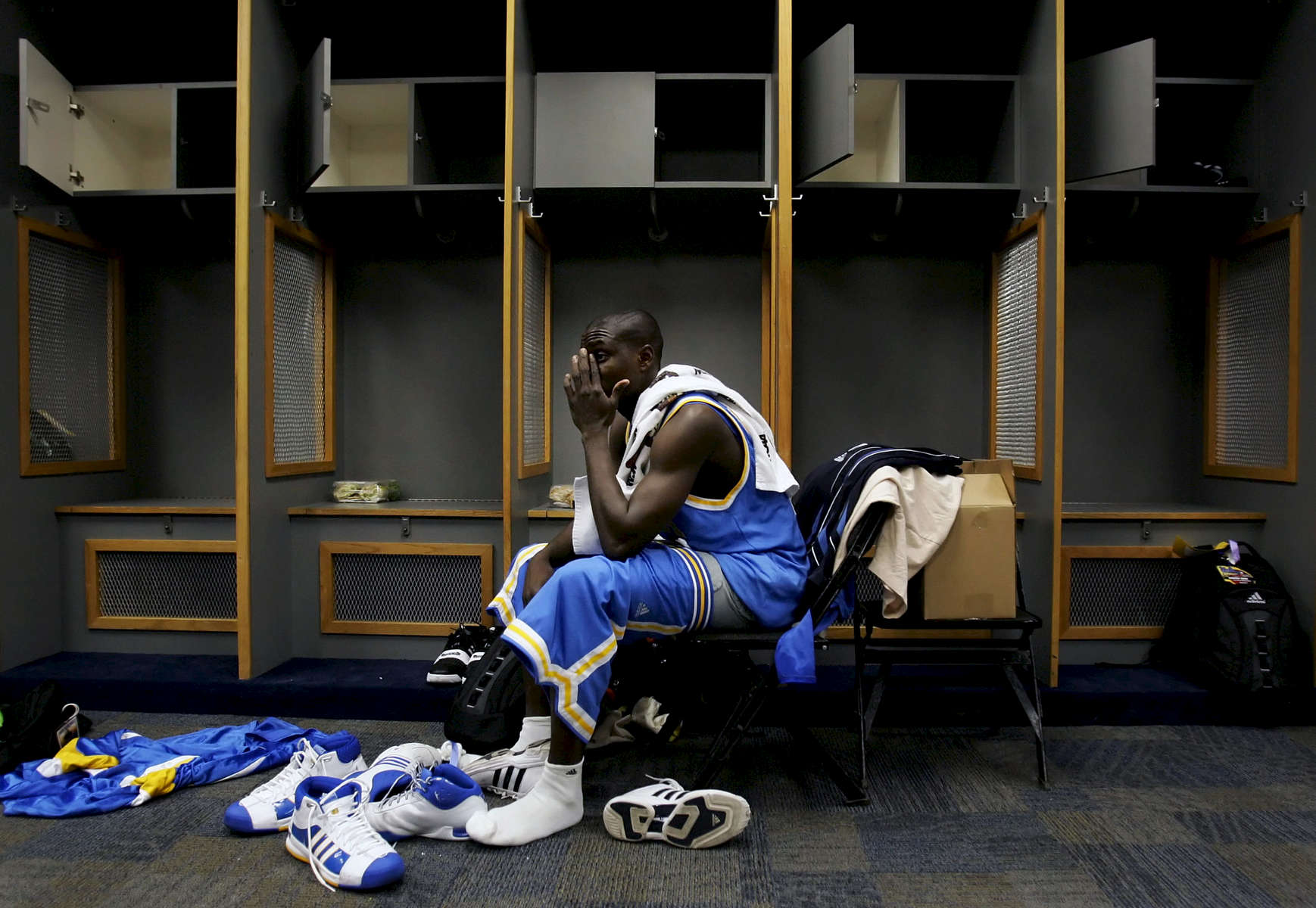UCLA's Darren Collison sits alone in the locker room after losing to the University of Memphis during the 2008 NCAA Division I Men's Final Four at theAlamodome in San Antonio, Texas. Memphis beat UCLA 78-63. (The Press-Enterprise/ Mark Zaleski)