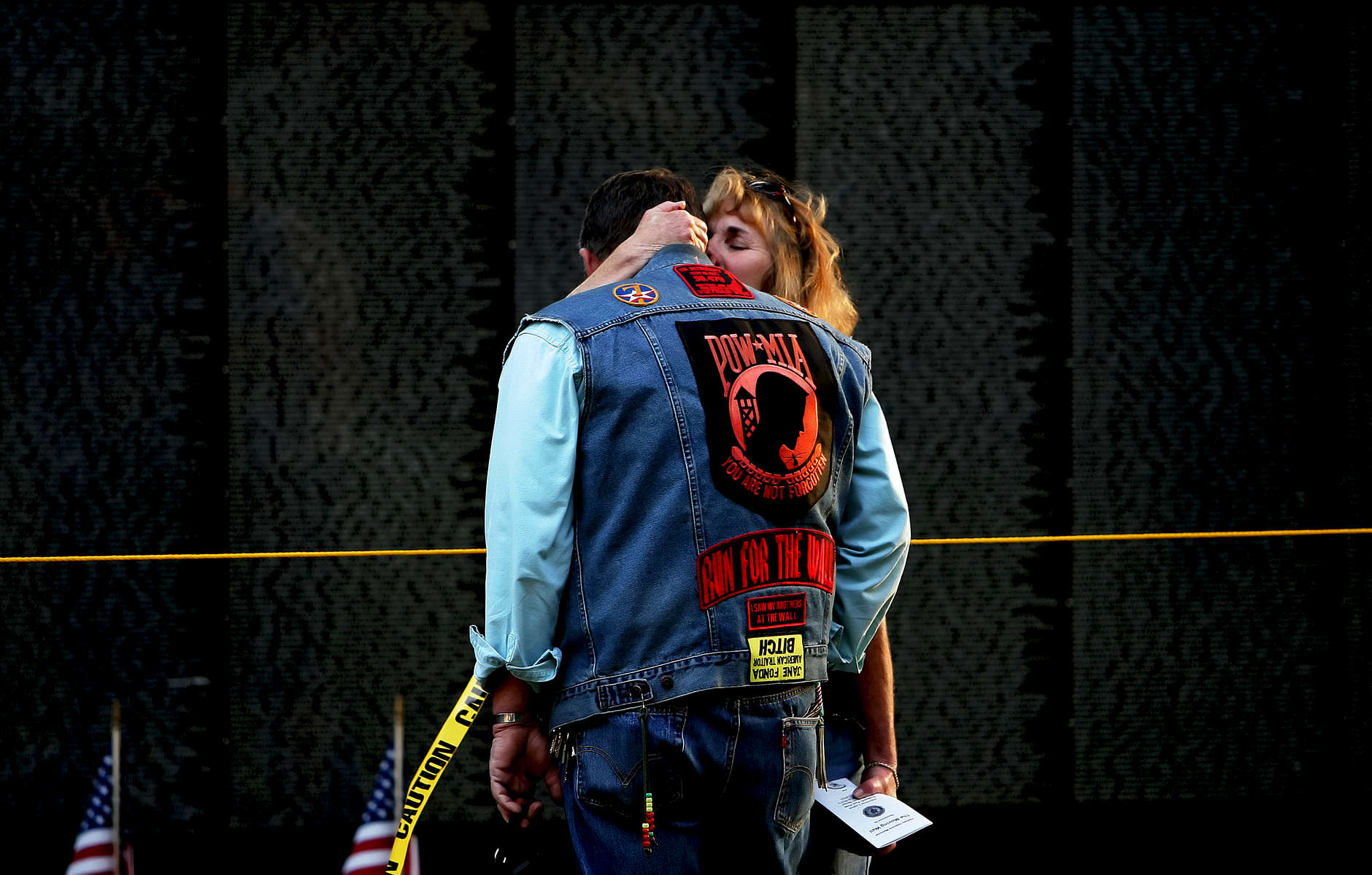 Robin Harp, 52, of Perris, Calif., kisses and comforts her husband United States Air Force Vietnam veteranBrent Harp as he broke down crying after seeing the name of his friend Jerald Coyle on the Vietnam Veterans Memorial Moving Wall at Sylvan Park in Redlands. Harp served two tours in Vietnam and was involved in the evacuation of Siagon. (The Press-Enterprise/ Mark Zaleski)