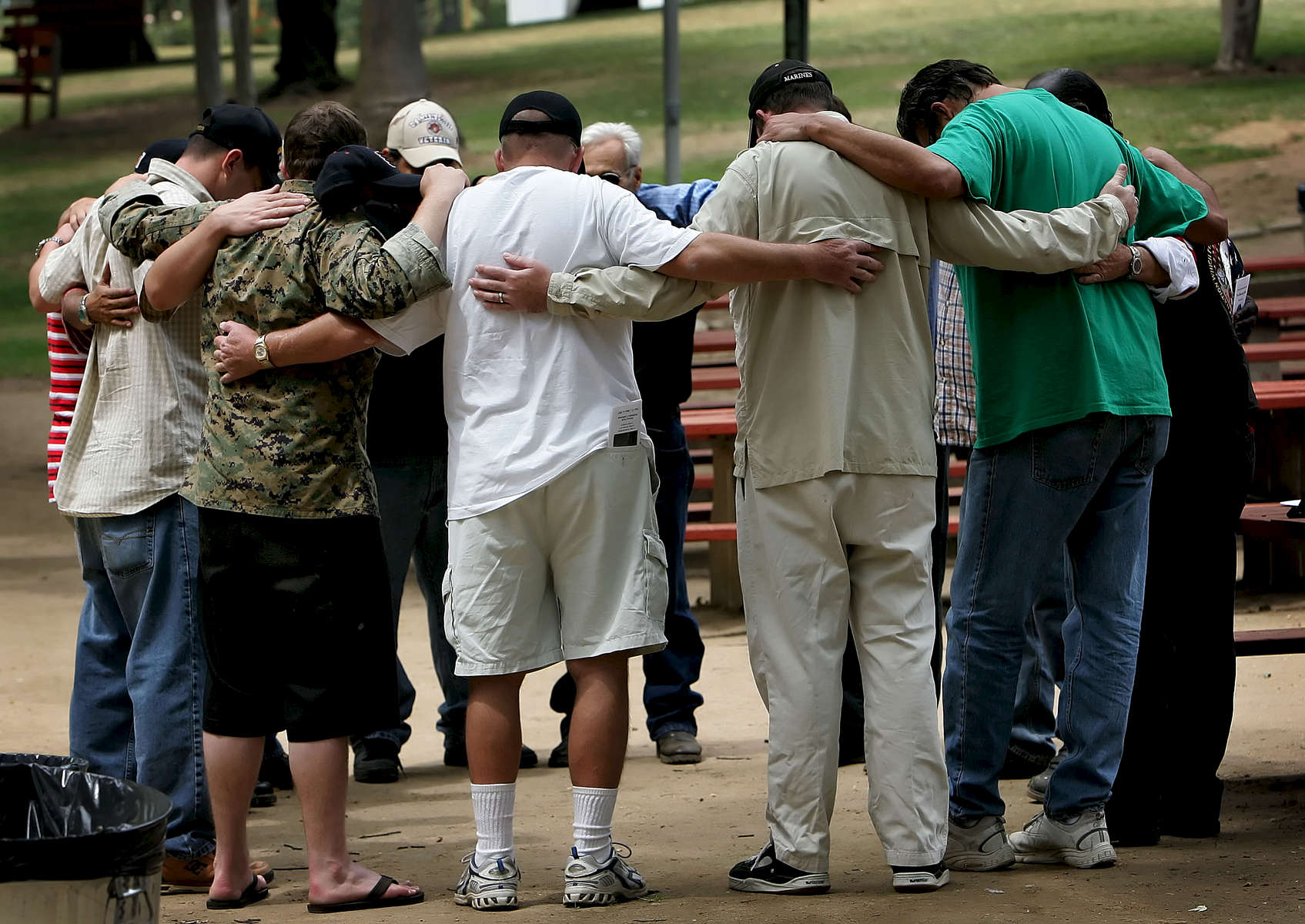 Veterans from the Loma Linda Veterans Hospital embrace while they say a prayer after visiting the Vietnam Veterans MemorialMoving Wall at Sylvan Park in Redlands, Calif. (The Press-Enterprise/ Mark Zaleski)