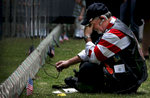 Bryan Brewer, 57, of Calimesa, Calif., starts to cry after finding the name of his sergeant, George Burrell, on The Moving Wall. Brewer retired from the United States Marine Corps and served two tours of duty in Vietnam from 1968-1969 and from 1970-1971. (The Press-Enterprise/ Mark Zaleski)