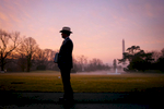 President Bush en route to the Oval Office. South Lawn. Sunrise. Cowboy hat.Bush Family Scrapbook