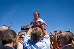Digital: 12:30 GWB  President Bush: Remarks at Farmington, New Mexico Rally. Ricketts Park. Political. Restricted The President holds a baby.