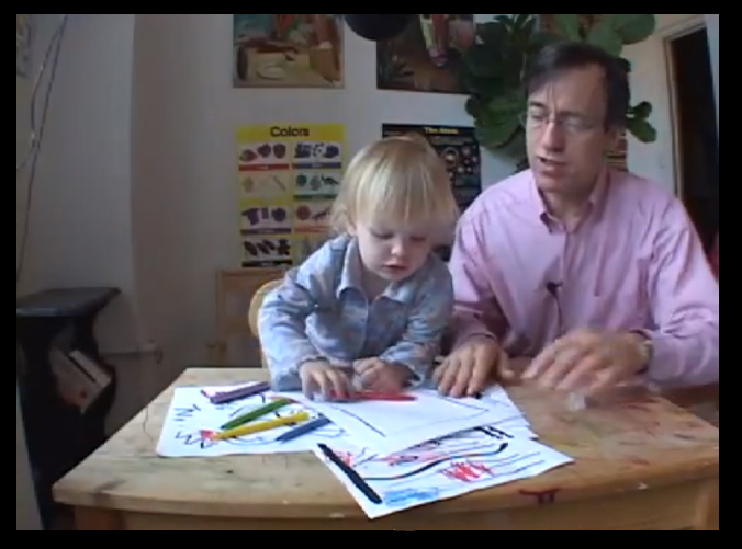 child and man at table drawingThe Genius Maker is work-in-progress, edited from footage shot over a period of 5 years. a vision of what can happen when parents get overly invested in their child's success in our increasingly competitive educational system. Joe Gibbons plays Dr. Baldwin the self-styled child education expert eager to put his unorthodox theories into practice. In Rumplestiltskin fashion, he manages to convince a pregnant couple that by allowing him to coach their daughter from birth, he can guarantee her acceptance into a coveted {quote}gifted-only{quote} kindergarden program.Dr. Baldwin documents his lessons with the young Zoe as proof that {quote}geniuses are not born, but made.{quote} What gets recorded over the next five years is his growing desperation for success and Zoe's growing indifference to it.Directed & Edited by Emily Breer; Performed, Shot and Recorded by Joe Gibbons