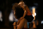 Twana and her baby Bonita are seen wearing protective goggles in case police use chemical irritants as they take part in a march for racial equality in downtown Washington, D.C., June 23, 2020, as protests against police brutality and in support of Black lives continue across the country.