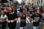 Protesters link arms during a march as racial inequality protests continue, in?Washington, U.S., June 23, 2020. REUTERS/Leah Millis     TPX IMAGES OF THE DAY